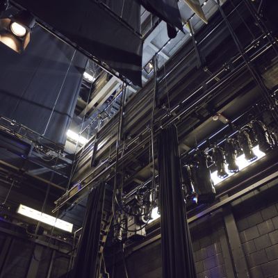 Looking up into the automation and lighting of the Milton Court Theatre